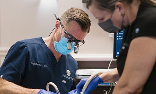 Dr. Oakley working on patient