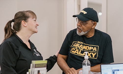 Dental team member at Spring Creek Dentistry interacting with patient at front desk