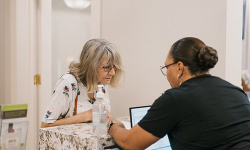 Female patient discussing payment options 