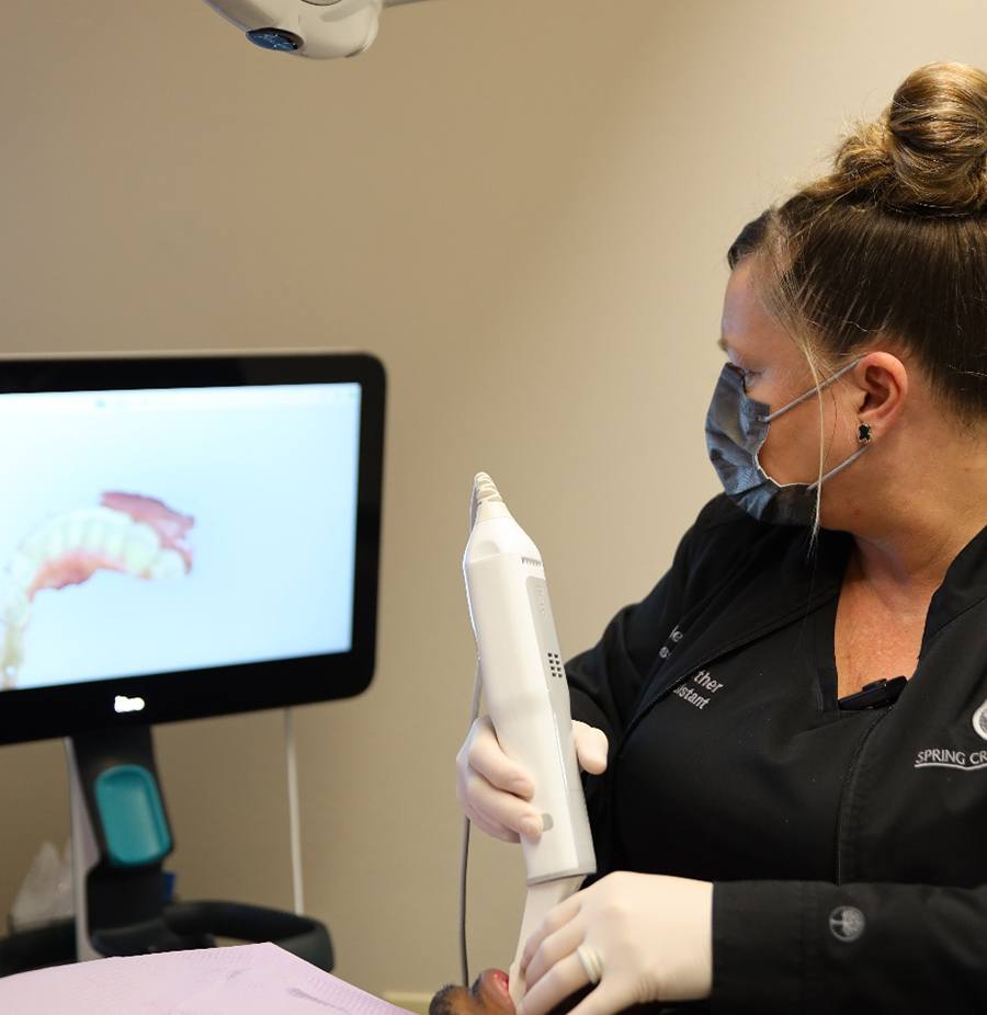Spring Creek Dentistry team member using digital impression scanner