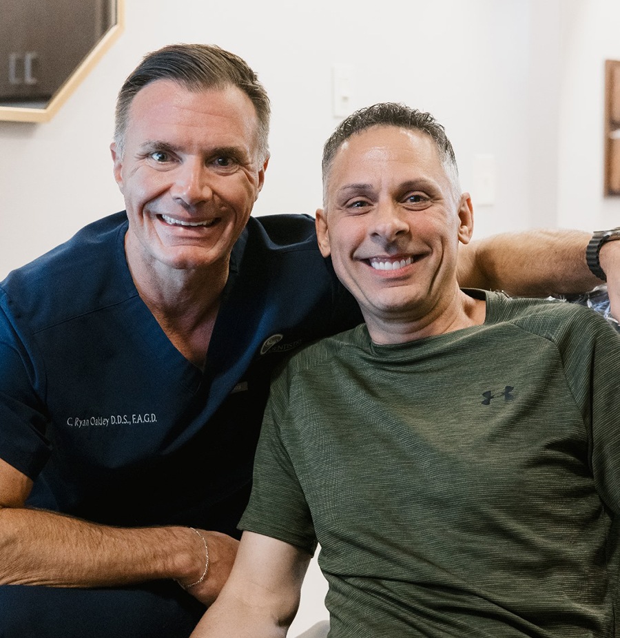 Dr. Oakley posing with patient at Spring Creek Dentistry