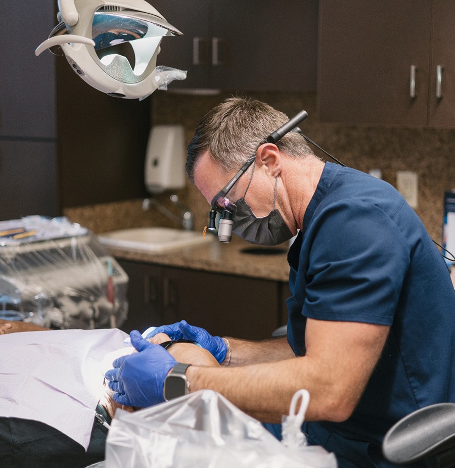 Dr. Oakley carefully working on patient