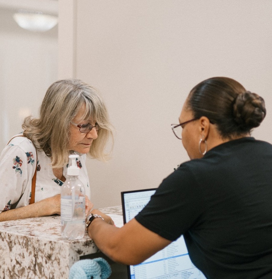Spring Creek Dentistry team member assisting patient at front desk