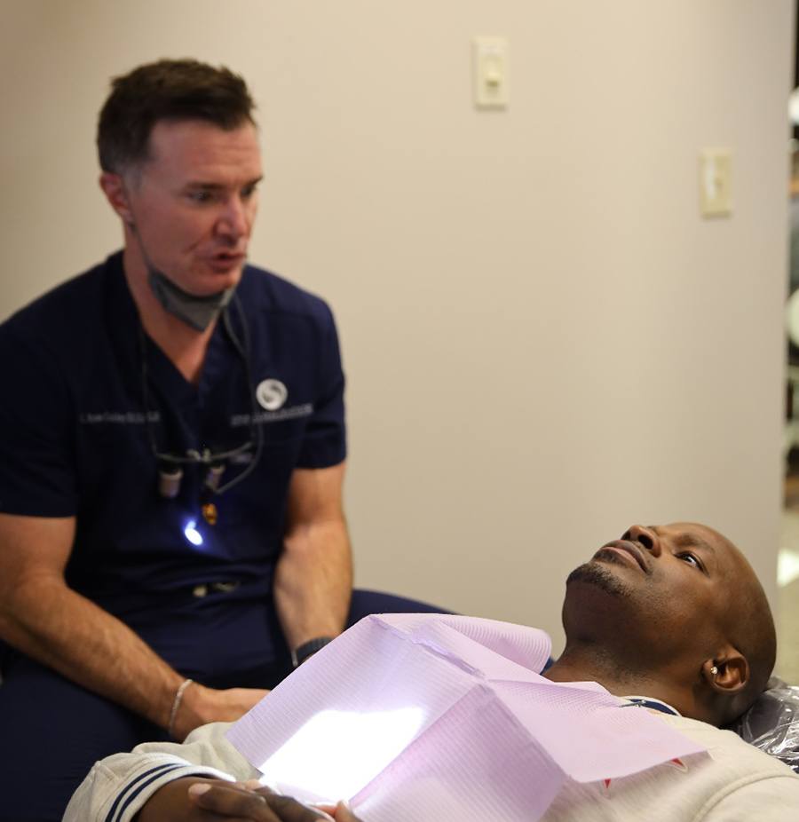 Dentist and patient talking during consultation at Spring Creek Dentistry