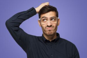 Frustrated man scratching his head